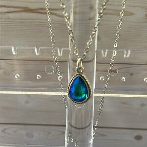 Elegant Gold Necklace with Blue Teardrop Pendant